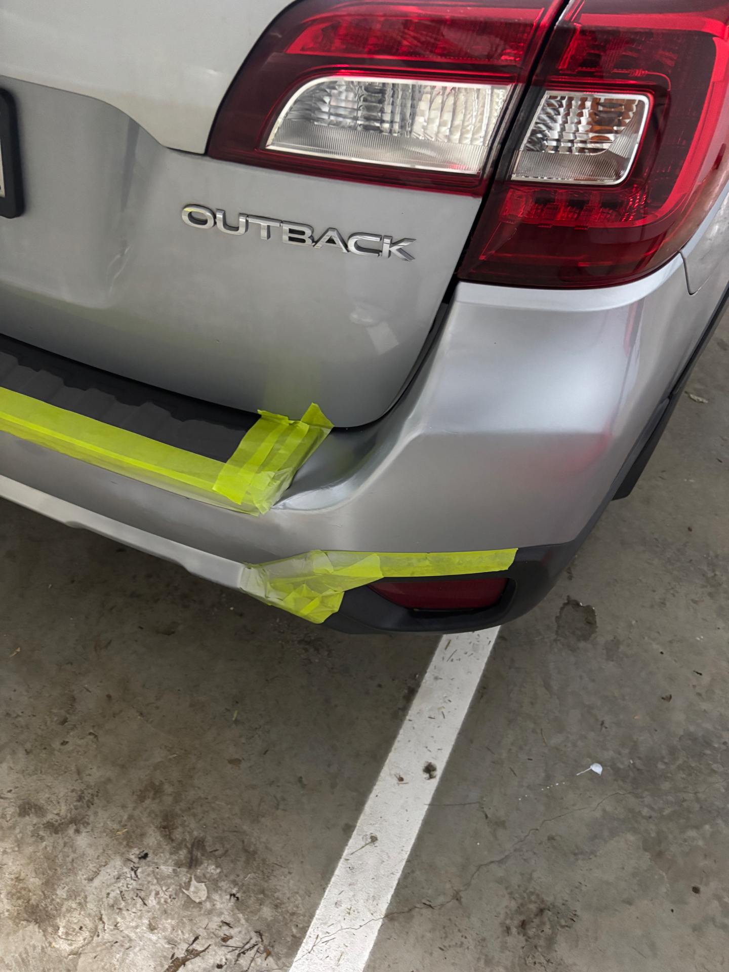 Outback bumper dent — pre-repair