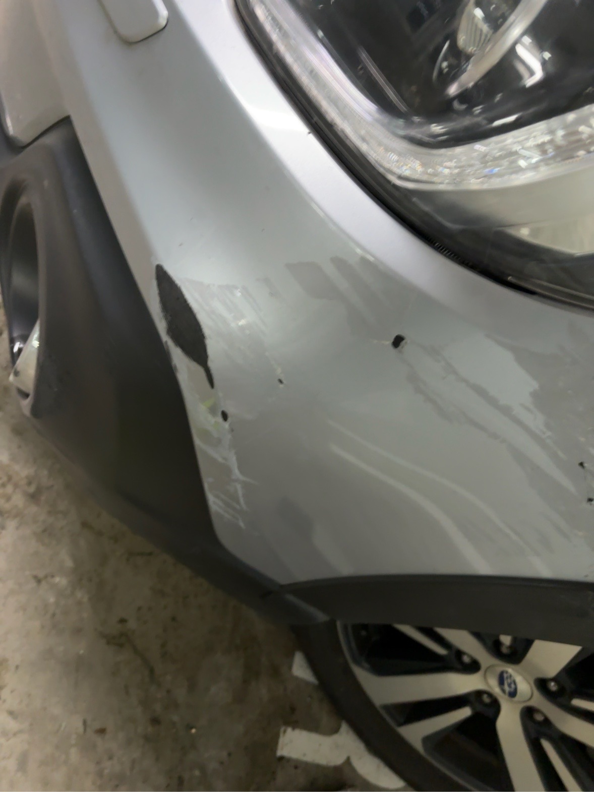 Deep bumper scuff — Ford